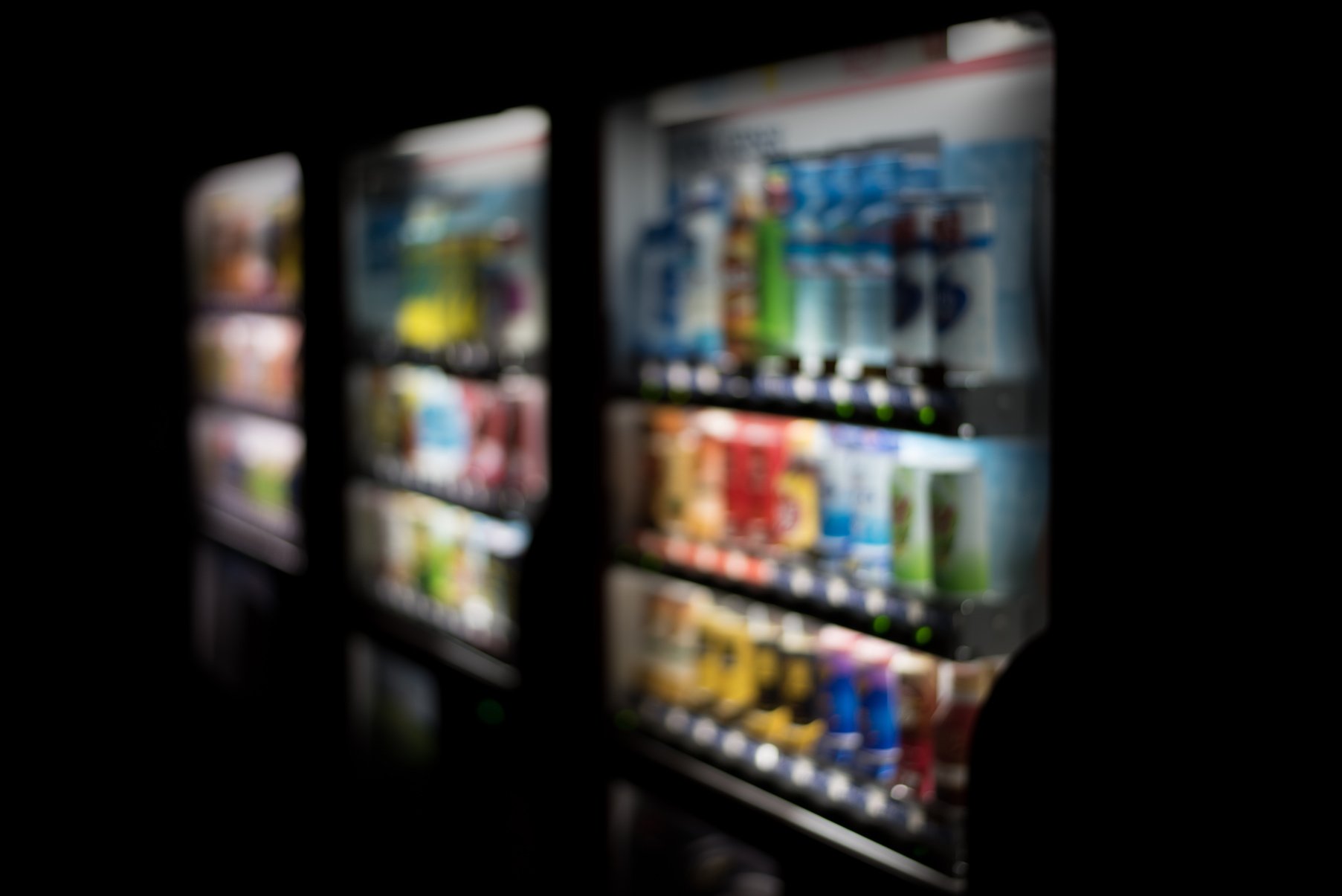 Blurredof colorful soft drinks vending machines